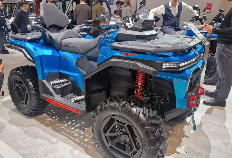 Blue CFMOTO CFORCE C6 Pro Touring ATV with a passenger seat and rear rack at a show